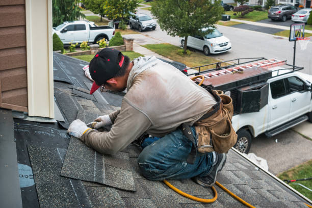 Professional Roof Replacement technician working in Harper, WV
